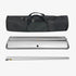 Set of silver metal rolls with a black carrying case on a white background