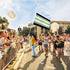Woman Holding Agender  Printed Polyester Flag 3ft by 5ft on 6ft Hand Held Pole at Outdoor Parade