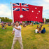 Man holding Australia Ensign  Printed Polyester Flag 3ft by 5ft on 6ft Hand Held Pole at Parade