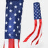 An American flag wind spinner shown from two angles against a plain white background, featuring a vertical section with white stars on a blue field and a horizontal section with red and white stripes.